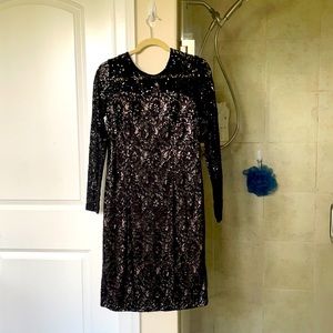 Dazzling black dress with nude underlay